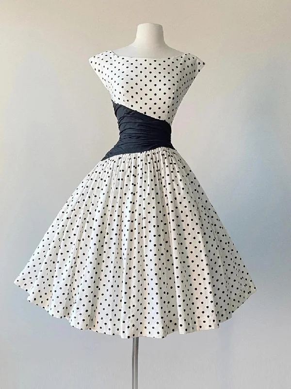 Cap Sleeve Vintage 50s Polka Dot Swing Dress with Black Asymmetrical Waist Panel