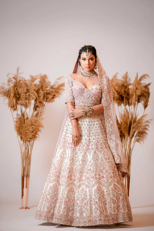 Ivory silk Lehenga with embroidered Corset Blouse Asymmetric Hem Blouse